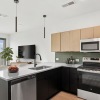 Westerly House unit interior kitchen featuring modern finishes and tile backsplash