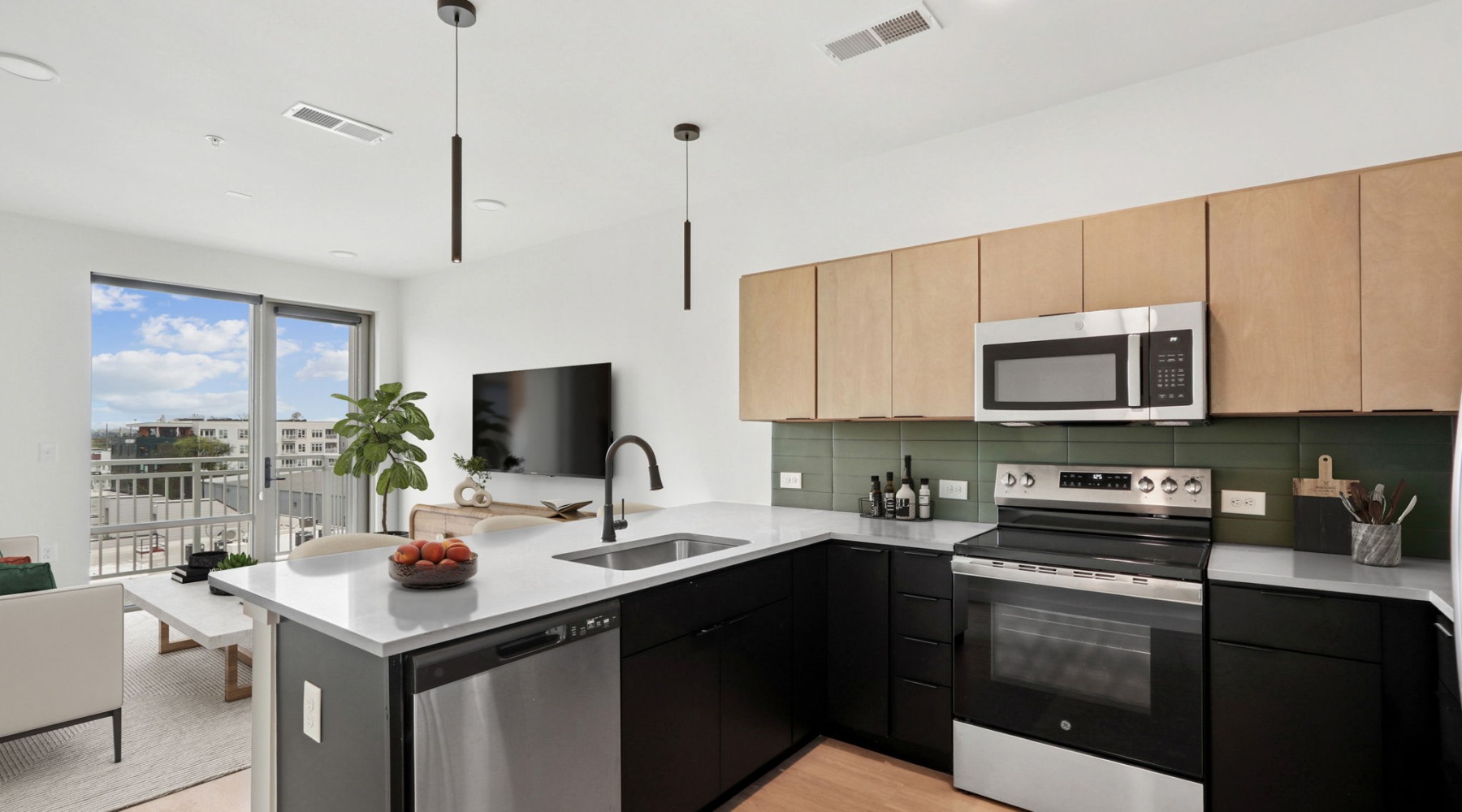 Westerly House unit interior kitchen featuring modern finishes and tile backsplash Westerly House unit interior kitchen featuring modern finishes and tile backsplash